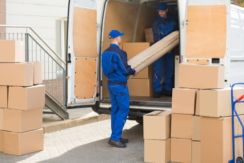 Chelsea residential removal team loading furniture near local townhouses