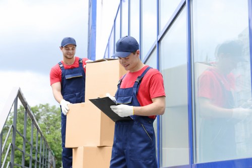 Crew wearing PPE while moving items safely