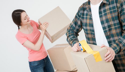 Business relocation team handling desks and IT equipment in Chelsea