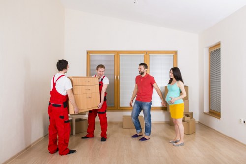 Chelsea flat removal van positioned for an apartment move near a residential street