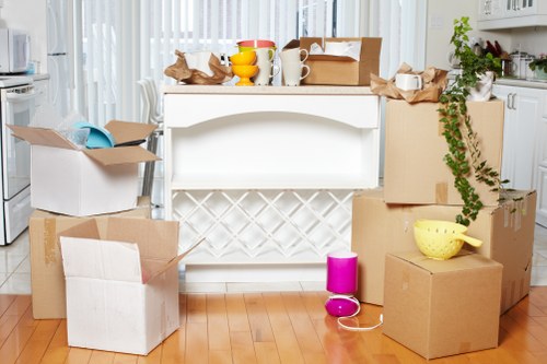Removal crew handling boxes and furniture during a Chelsea relocation