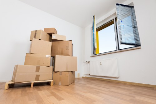 Preparing labelled office boxes and equipment for relocation in Chelsea