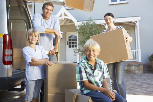 Removal team planning a house move with inventory checklist