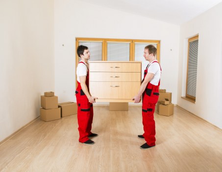 Local movers loading furniture for a short-notice Chelsea relocation